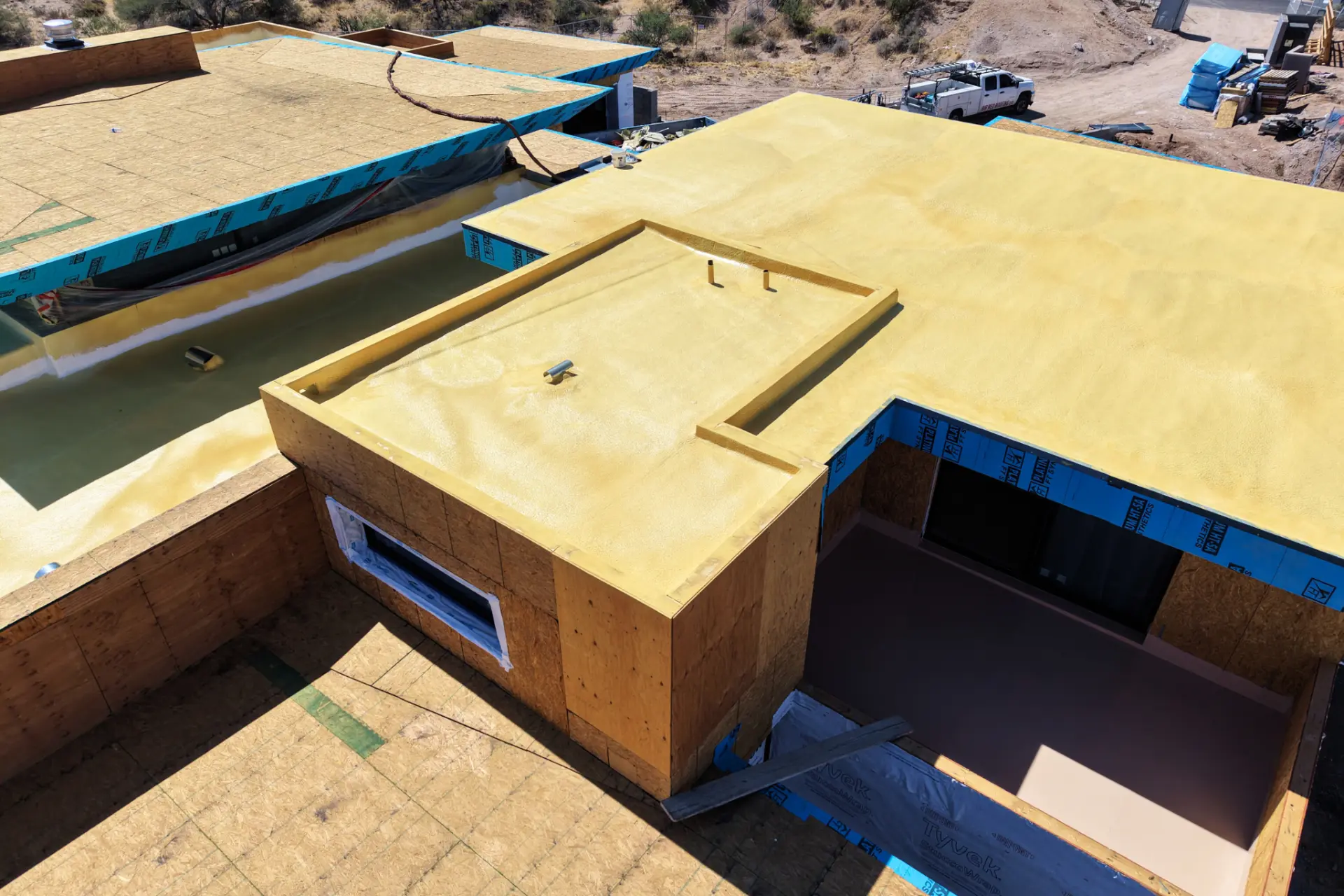 Foam roofing on a modern flat roof custom home