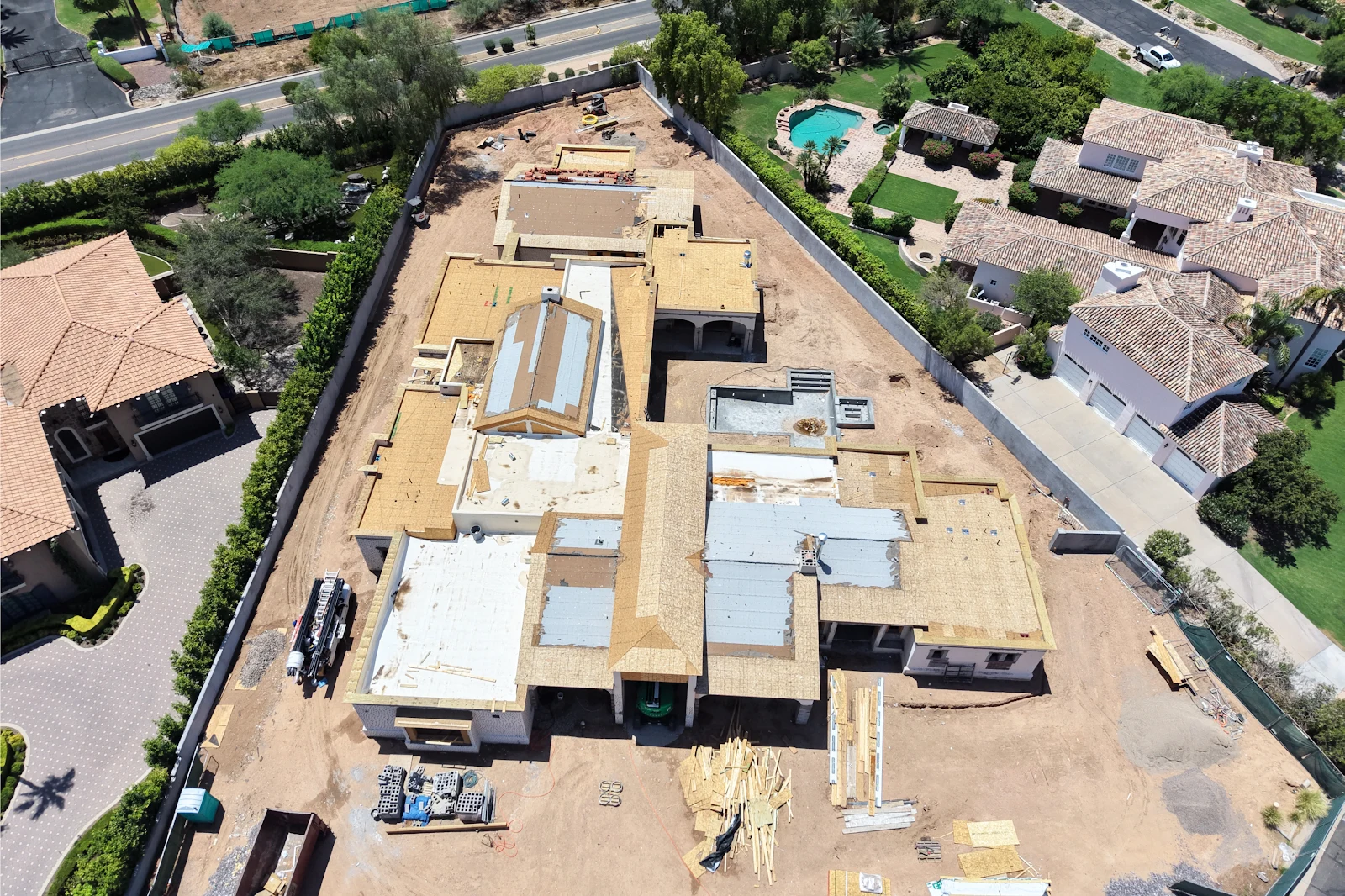 Aerial view of a large new home with the roof deck sheathed