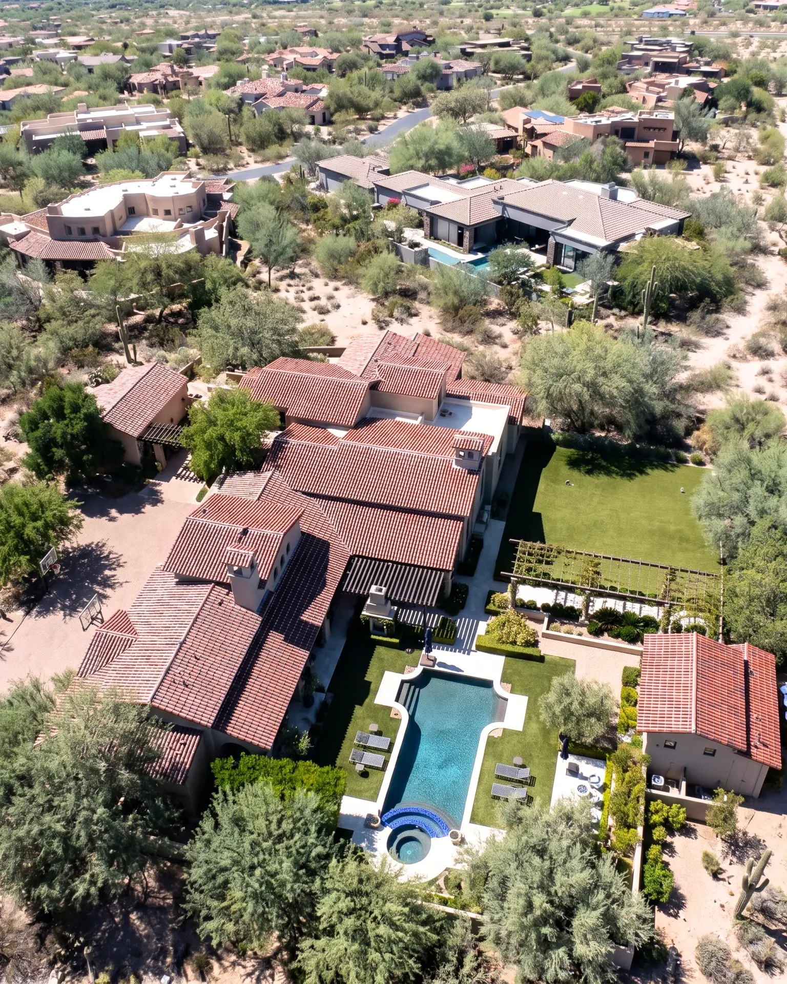 Aerial view of a completed clay tile roof on a large home